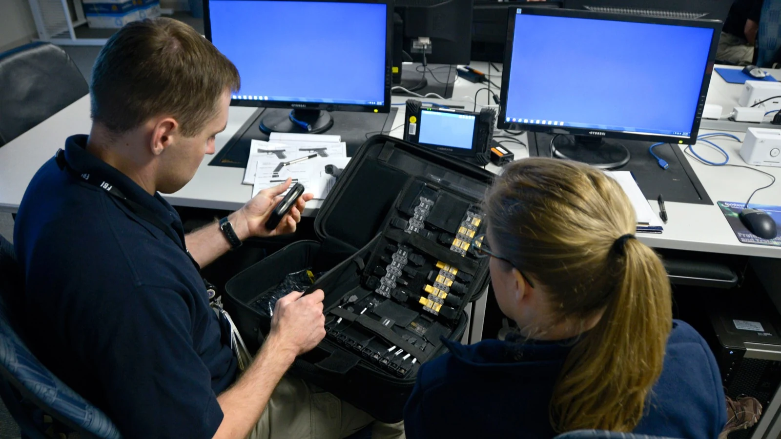 FBI special-agent and intelligence-analyst trainees work together during the Basic Field Training Course at the FBI Academy.