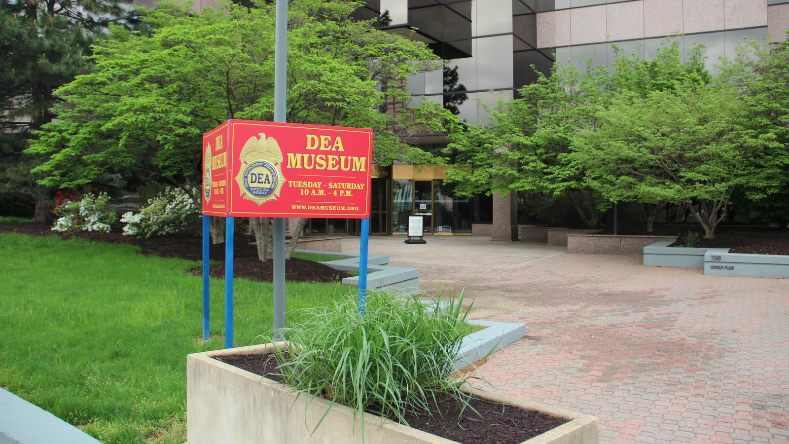Red DEA Museum sign outside the museum entrance in Arlington, Virginia.