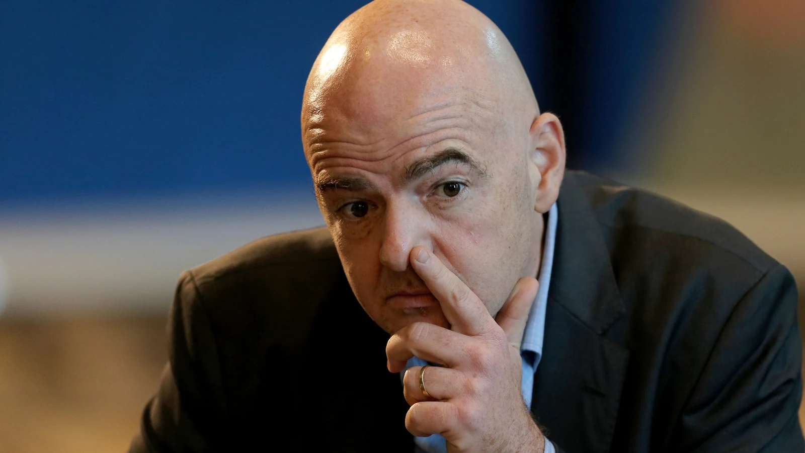 FIFA President Gianni Infantino sits with his hand against his face during a 2017 press conference in Doha.