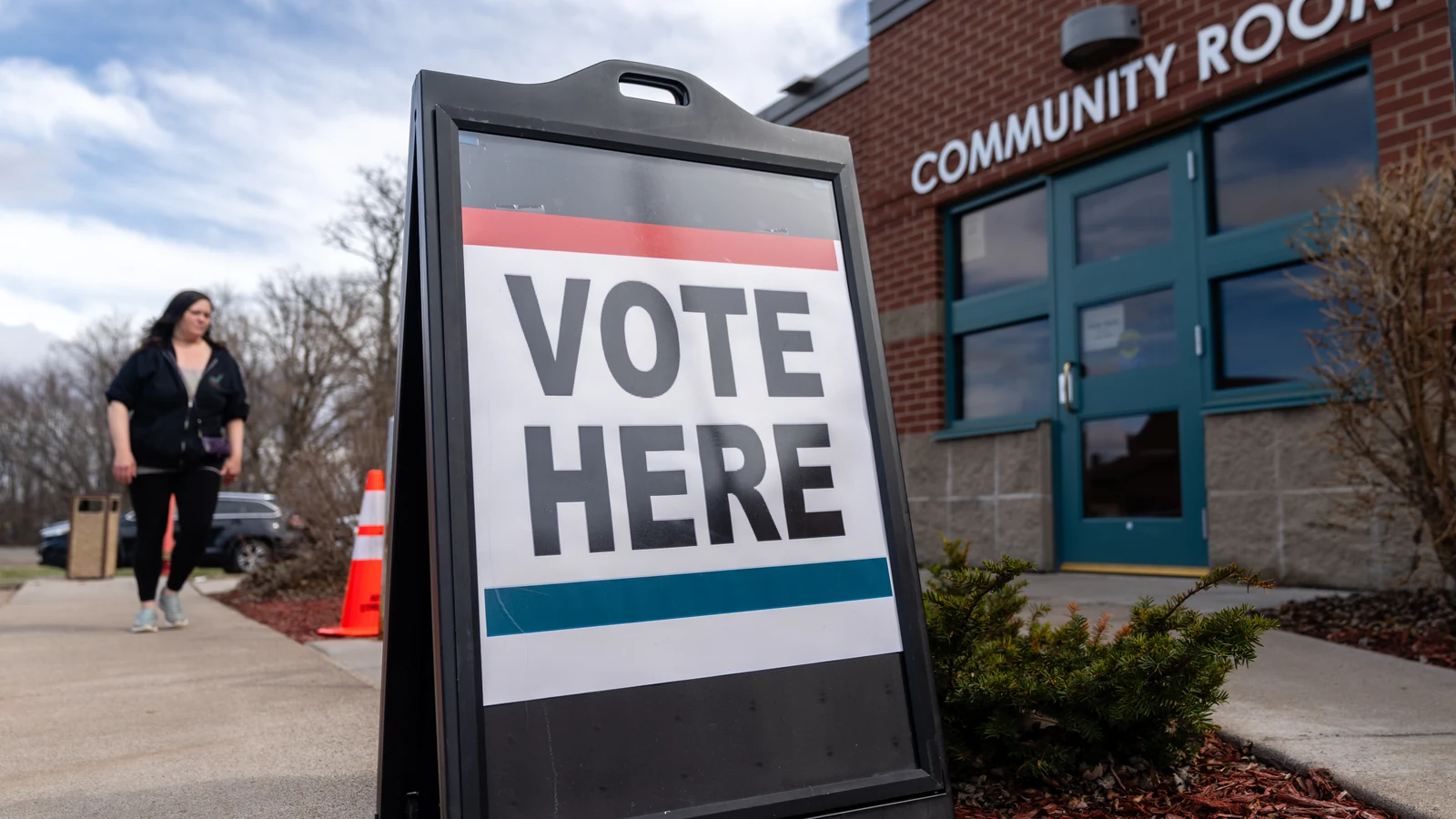 A voter walks toward a public library serving as a polling place in Aitkin, Minnesota.