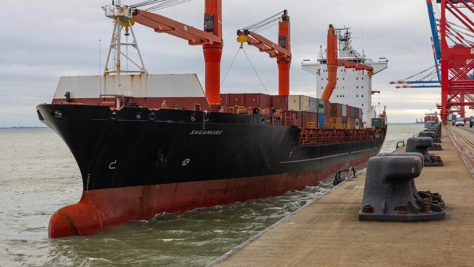 A cargo ship approaches the EUROGATE container terminal at Wilhelmshaven, Germany.