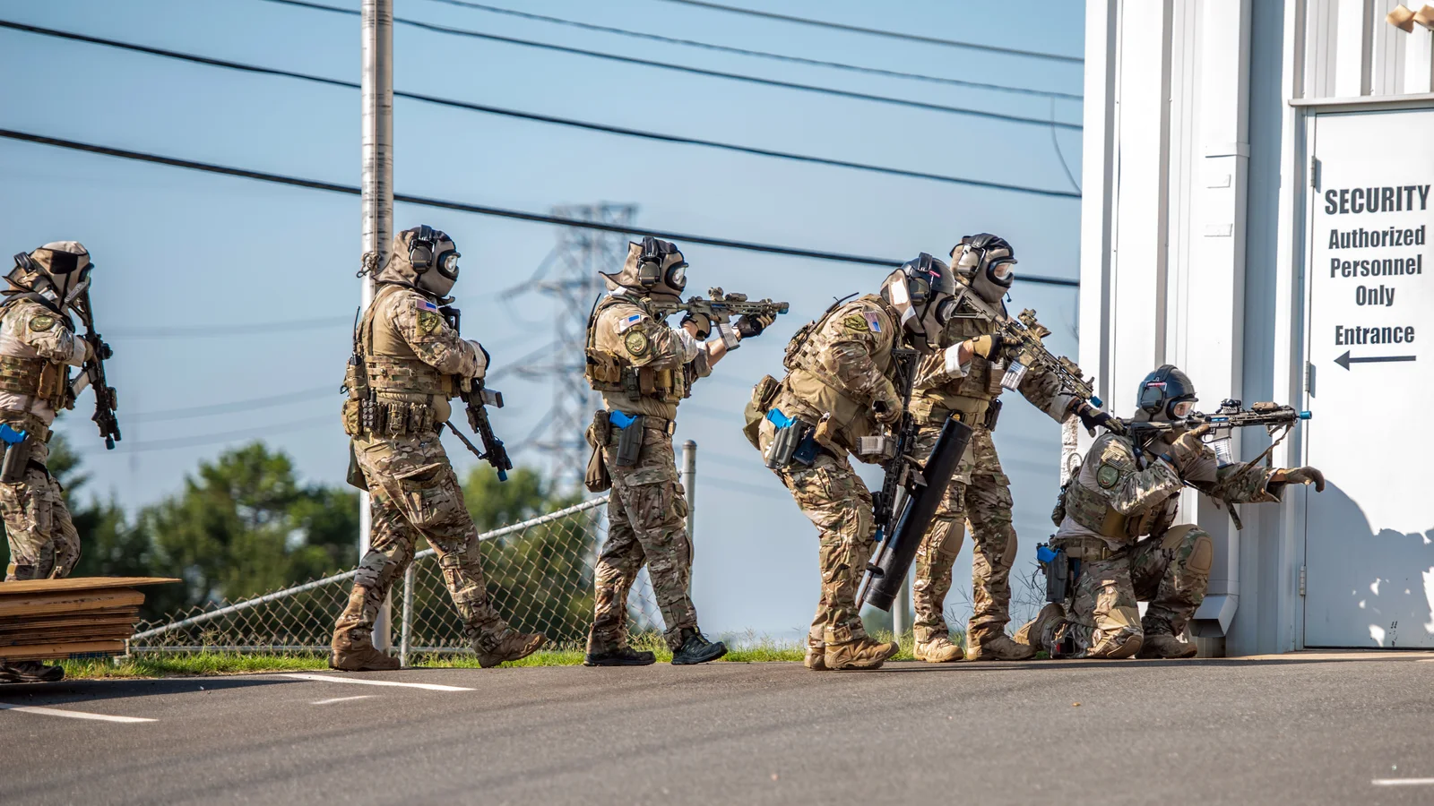 Federal law enforcement officers participate in an outdoor training exercise.