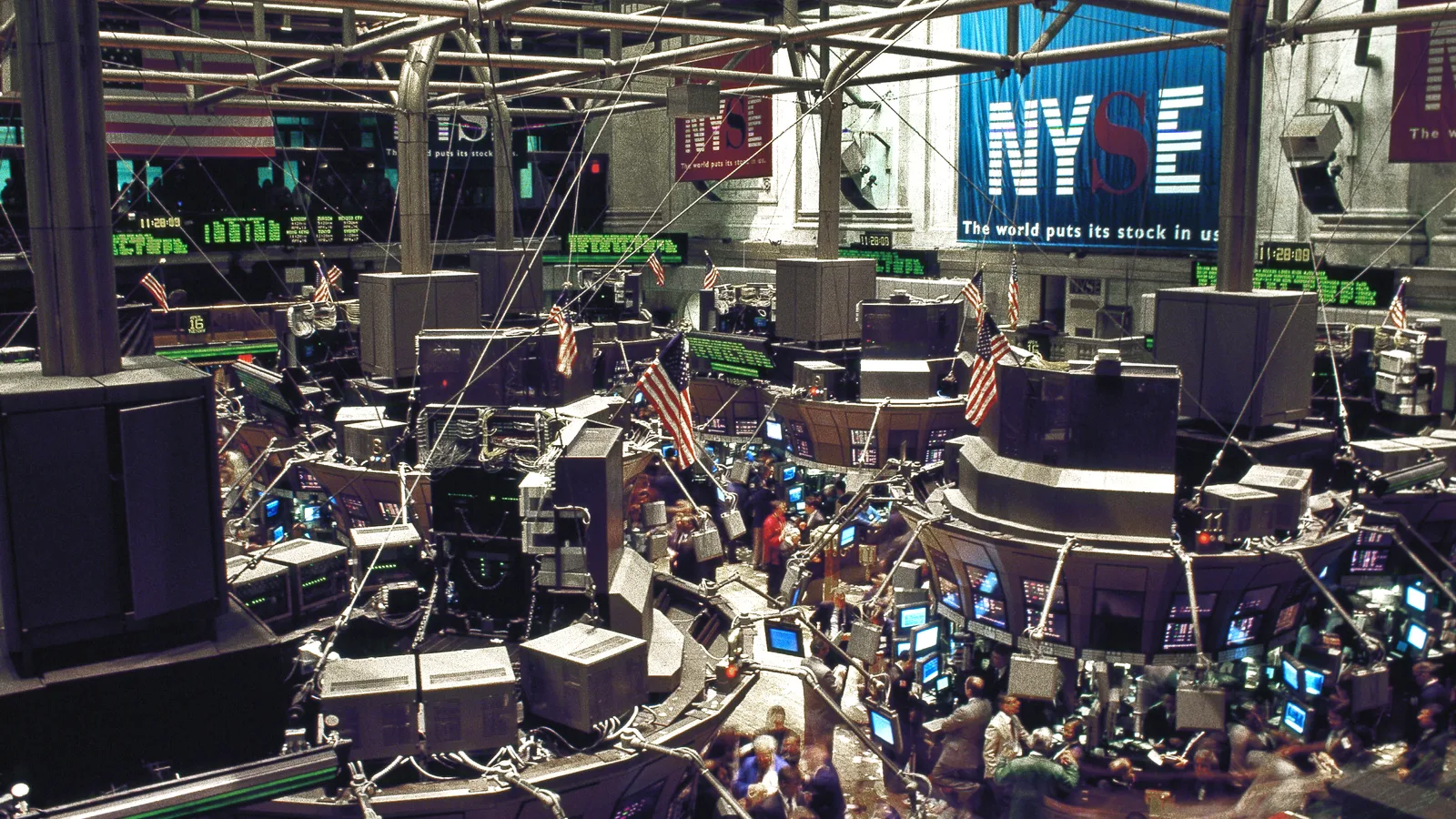Traders and electronic displays on the New York Stock Exchange floor.